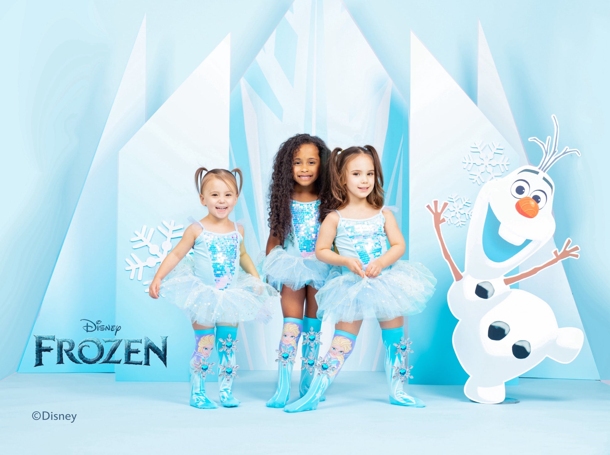 Colorful Disney Frozen Elsa socks for kids and adults with playful snowflake and gem details.
